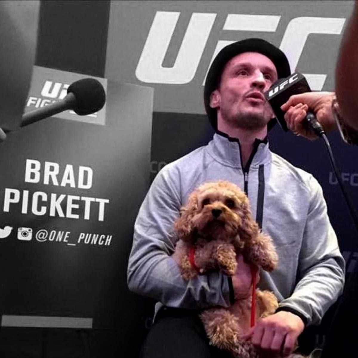 Brad Pickett at UFC event holding his dog
