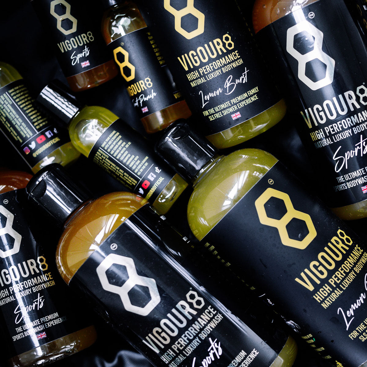 Multiple bottles of Vigour8 body wash with visible branding.
