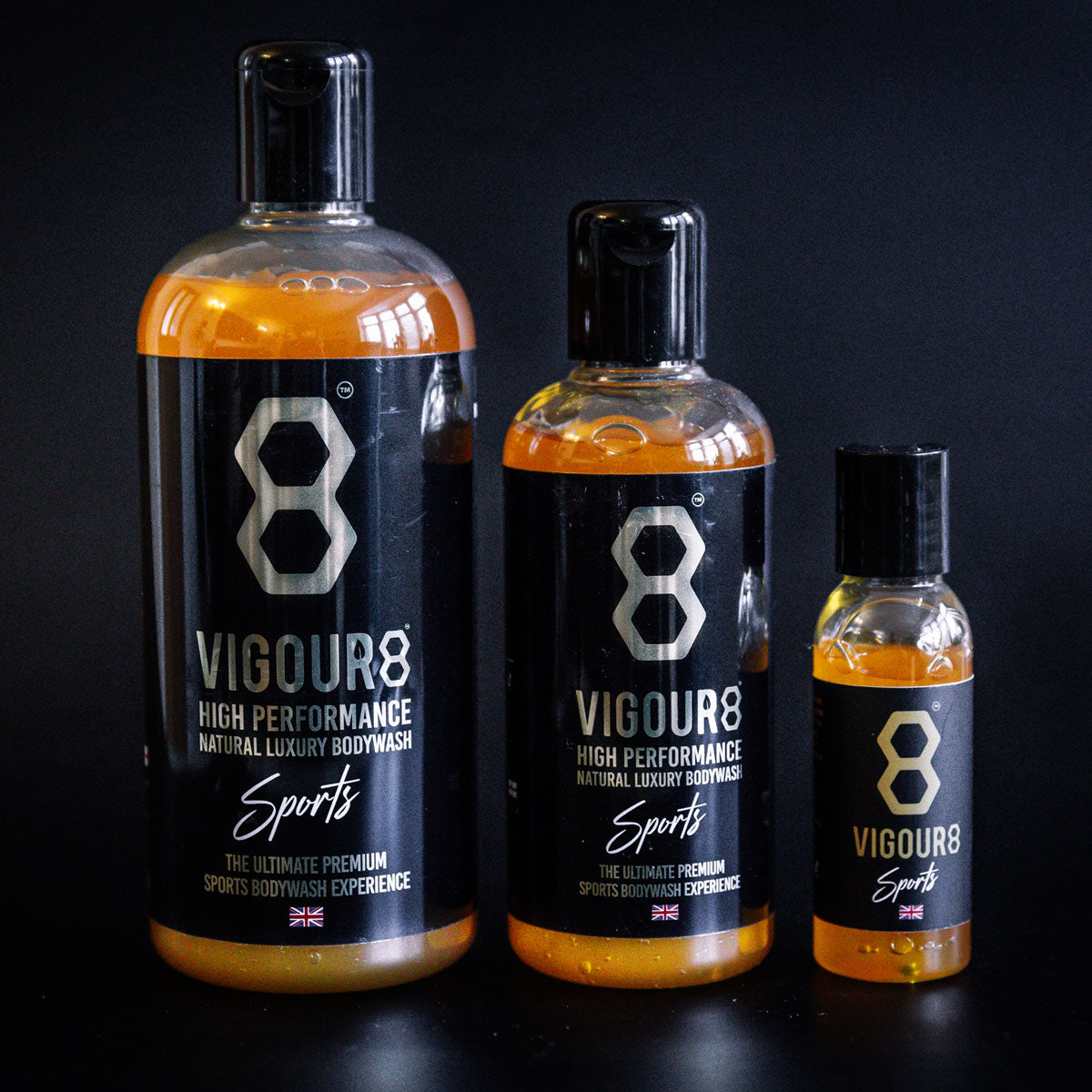 Three bottles of Vigour8 bodywash on a black background